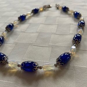 Necklace with dark blue and foggy white beads. Christian artist. Homemade.